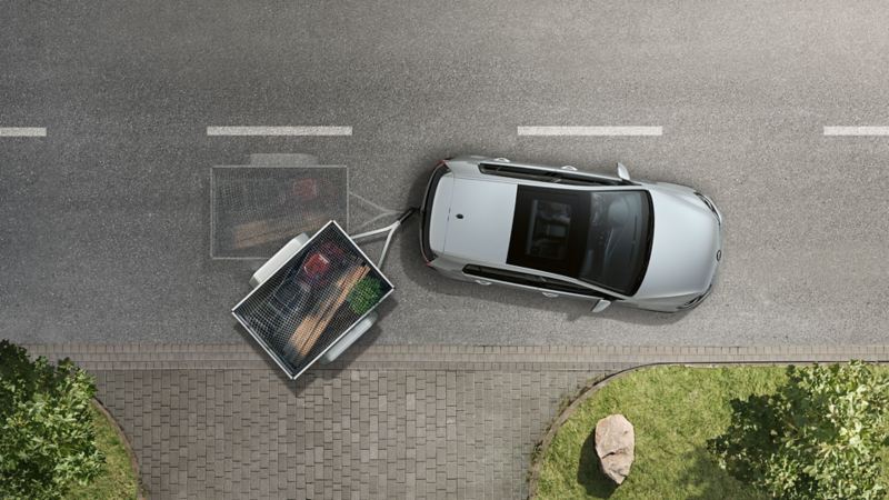 Rappresentazione grafica del sistema di stabilizzazione elettronica di vettura e rimorchio su una Volkswagen Golf vista dall'alto.