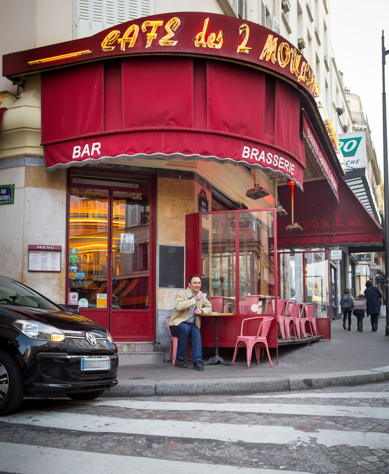 Alexandre Marie is sitting in a café, his e-up! is parked next to him