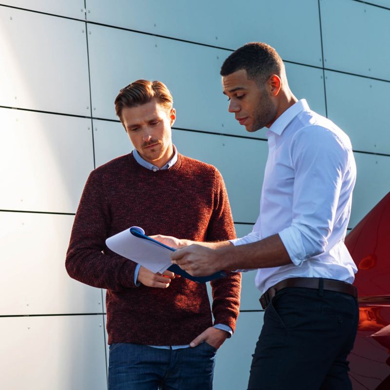 Woman at her Volkswagen's retailer