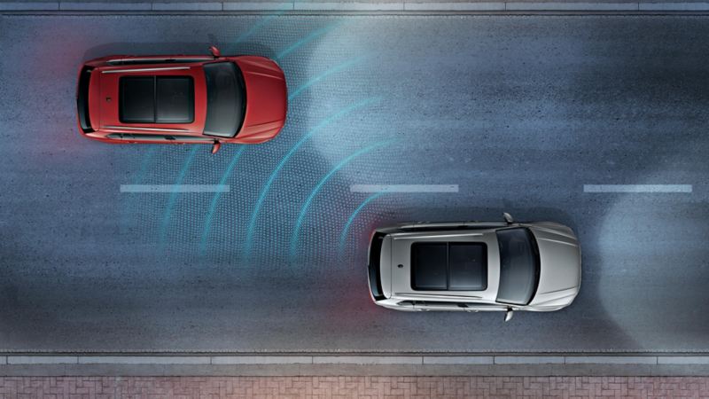 Rappresentazione grafica del funzionamento del 'Side Assist', il sistema di assistenza al cambio di corsia, di un'auto Volkswagen.