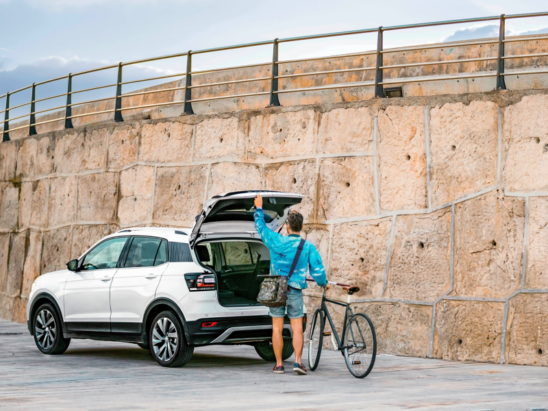 Daniel stowing his bike in the T-Cross