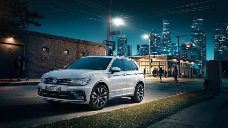 A VW Tiguan R-Line on a road at night