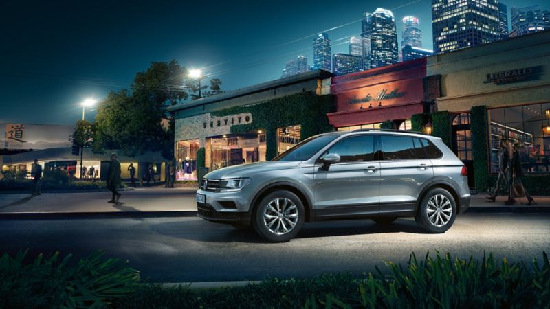 VW Tiguan near storefront