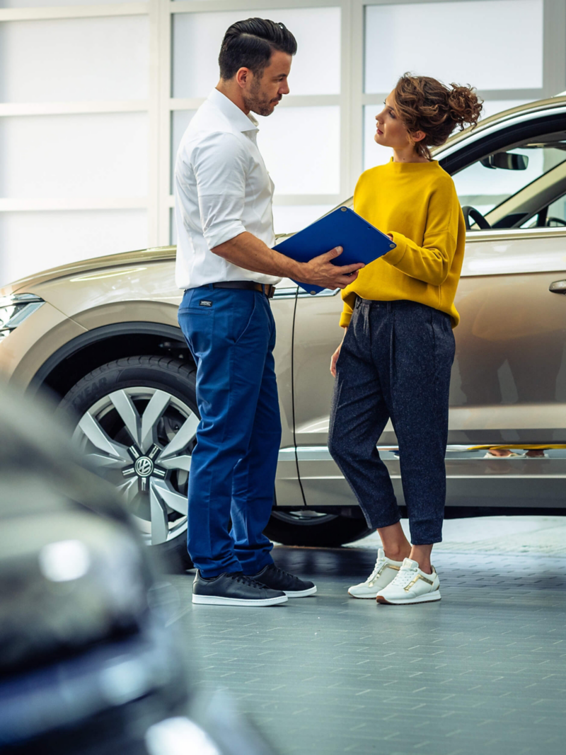 Volkswagen Services a retailer talking with a customer