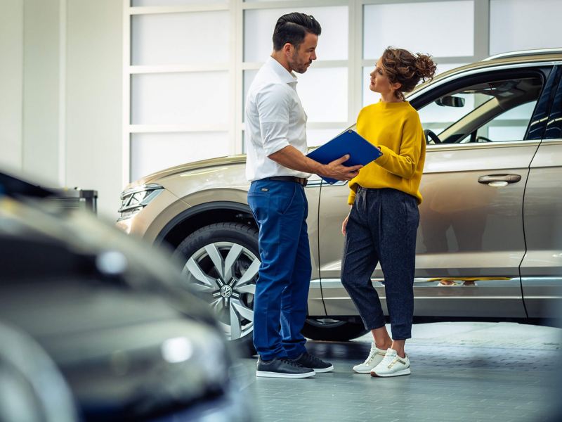 A Volkswagen Service Manager talking to a customer 