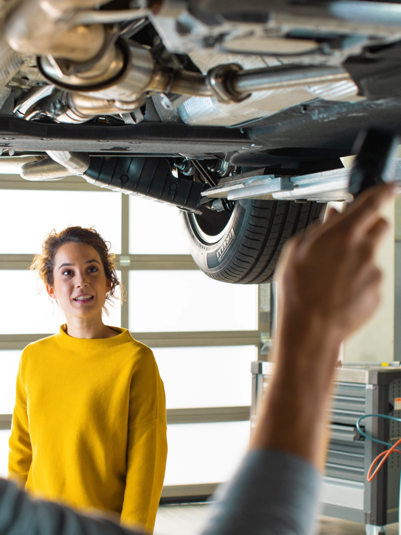 Technician under a Volkswagen car