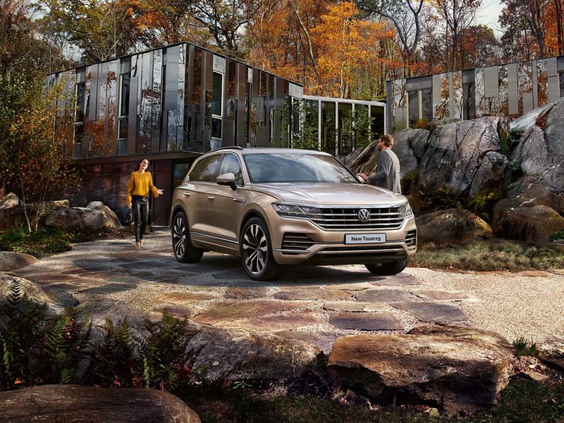 Volkswagen New Touareg parked by a cabin 