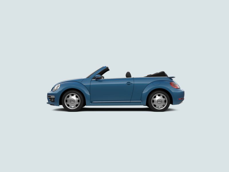 Profile view of a blue Volkswagen Beetle Cabriolet, with the soft-top roof down.