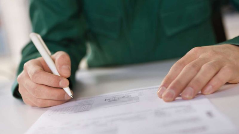 Man signing contract close up