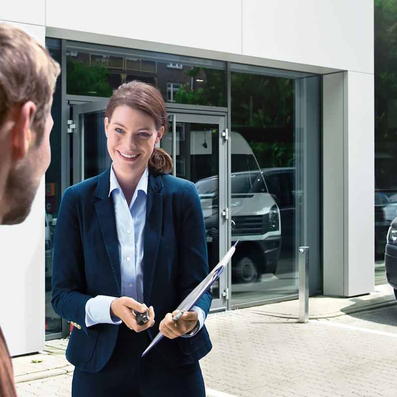 A VW Service Manager talking to a customer