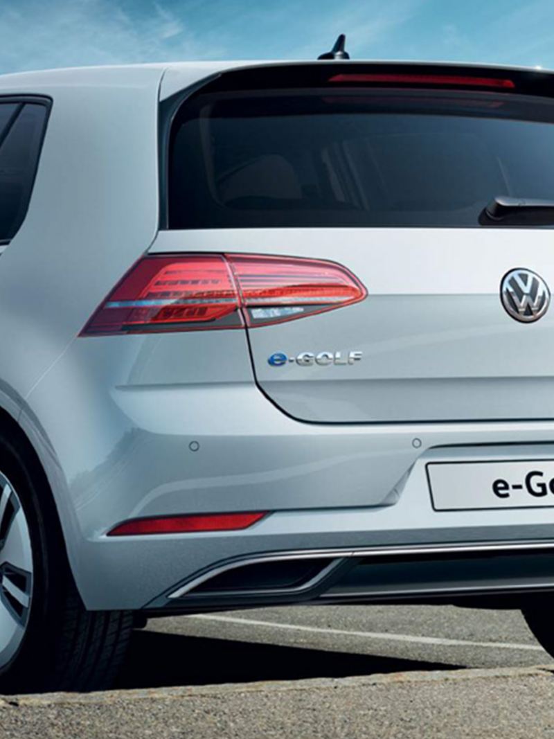 3/4 back view of a white Volkswagen e-Golf.