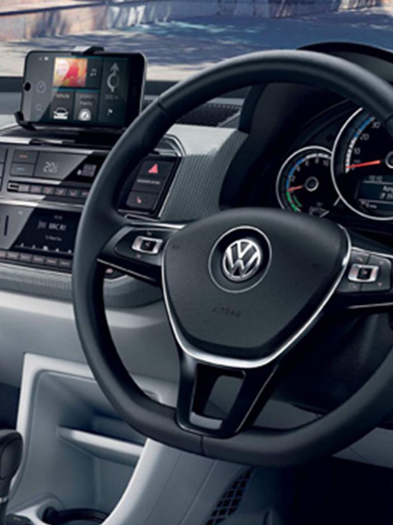 Interior shot of a Volkswagen e-up!, steering wheel and dashboard.