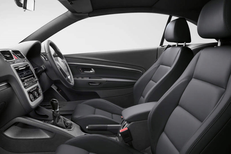 Front interior dashboard and steering wheel shot of a Volkswagen Eos.