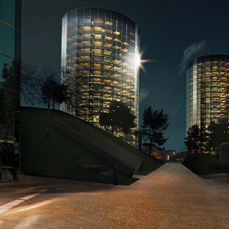 A night shot of two buildings