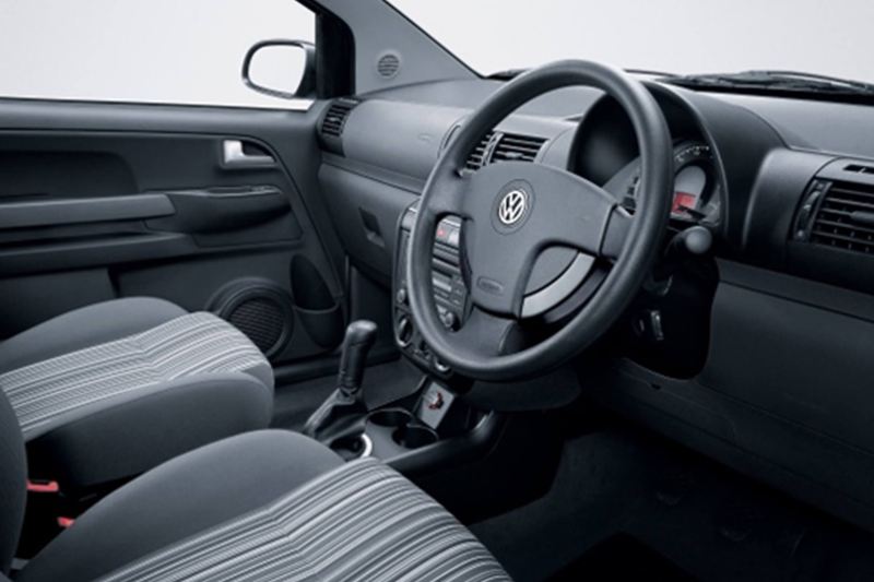 Interior shot of a Volkswagen Fox, steering wheel and dashboard.