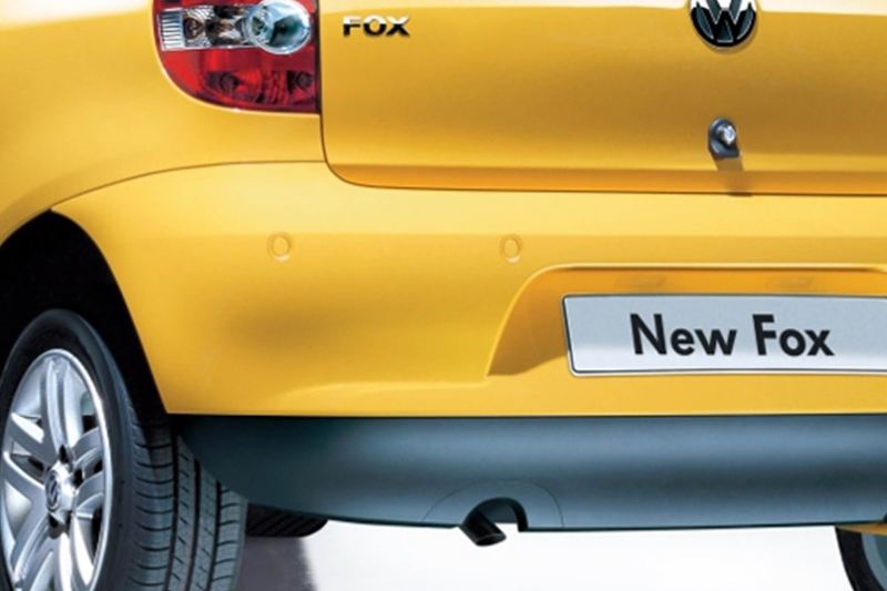 Rear view of a yellow Volkswagen Fox.