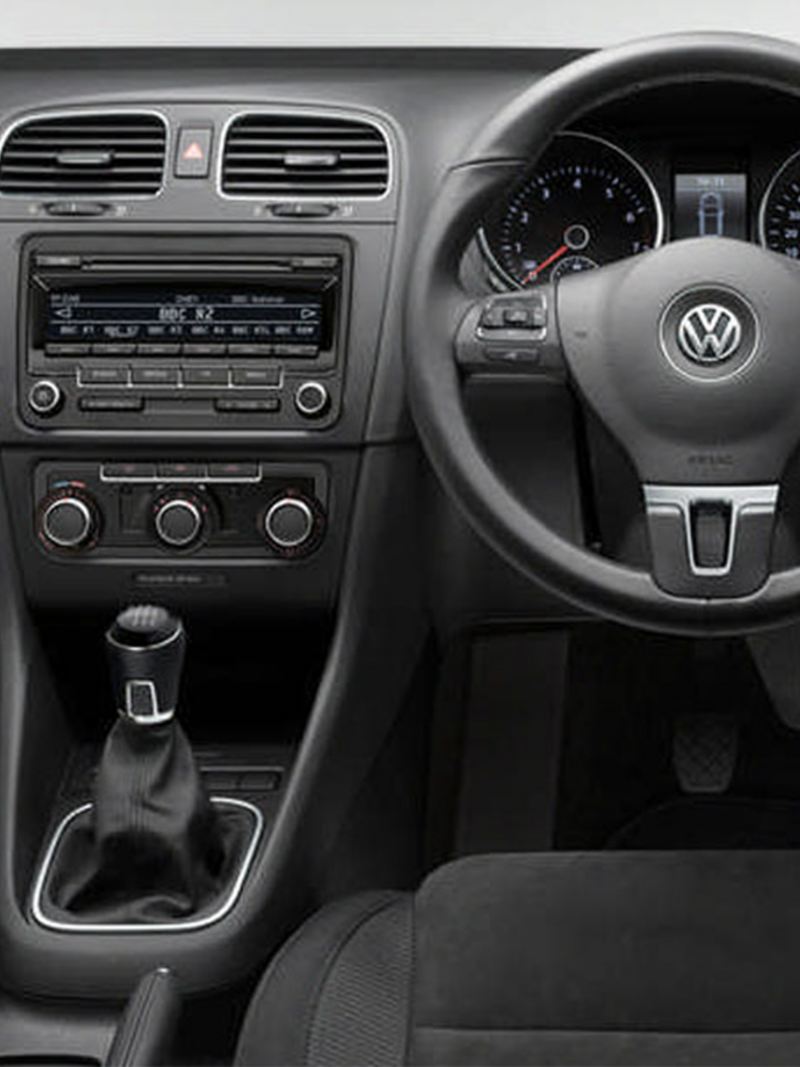 Interior shot of a Volkswagen Golf Estate, steering wheel and dashboard.