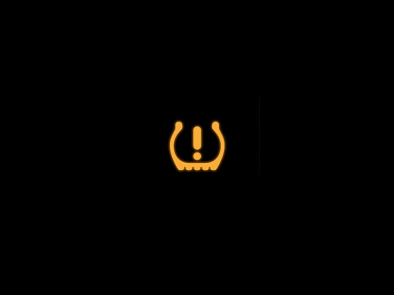 Yellow tyre pressure monitoring system warning light