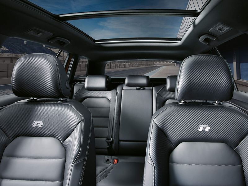 Interior shot of the Volkswagon Golf Estate, front and rear seats, expansive sunroof shown.