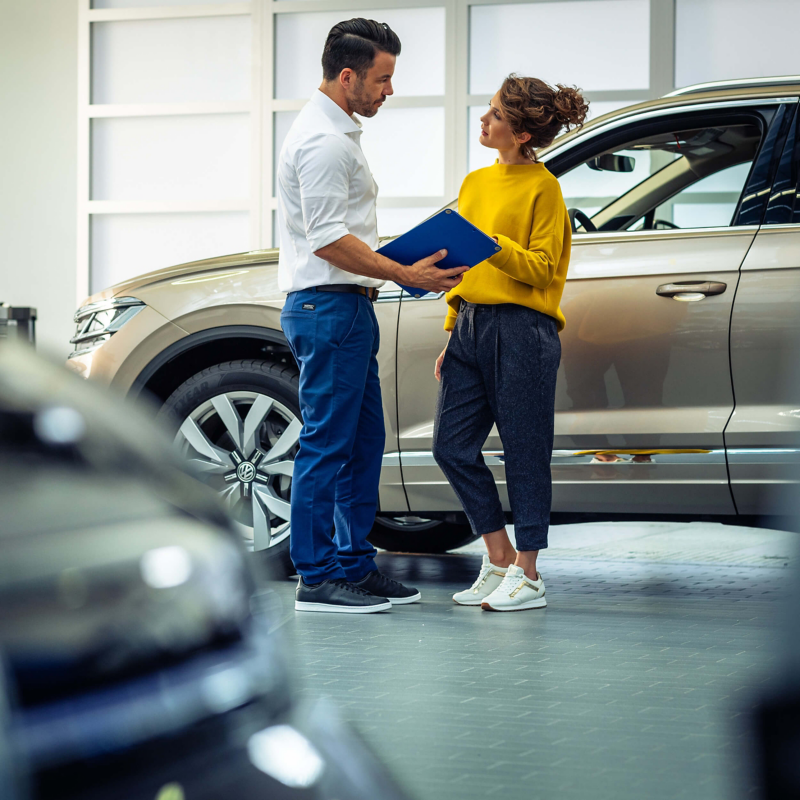 A lady at her Volkswagen retailer