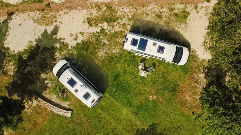 Aerial view of satellite and solar panels on VW Grand California pair