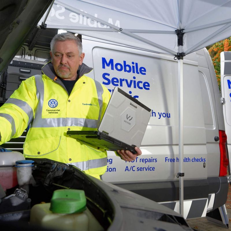 VW Mobile Service technician fixing van
