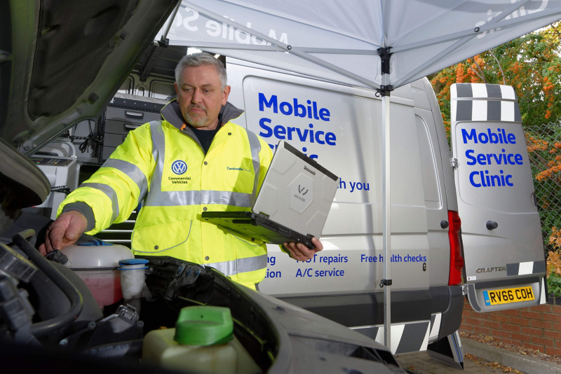 VW Mobile Service technician fixing van