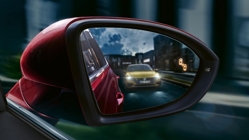 Shot of Volkswagen car reflected in a wing mirror