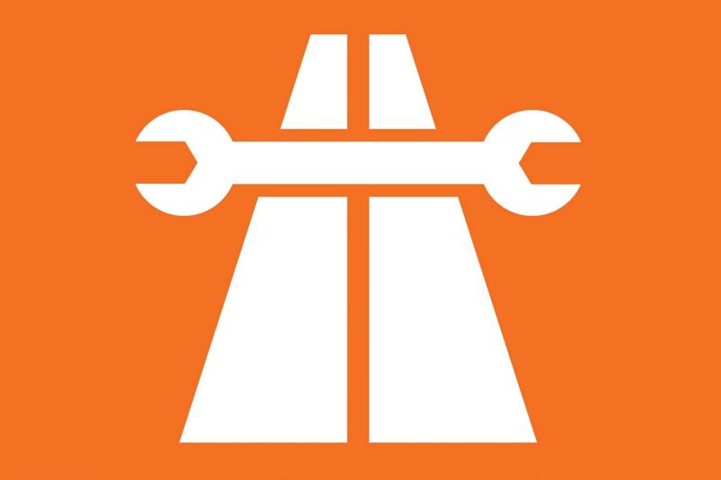 White spanner across two parallel white lines on orange background