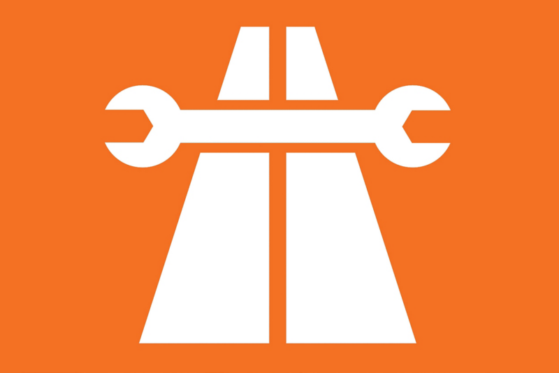 White spanner across two parallel white lines on orange background