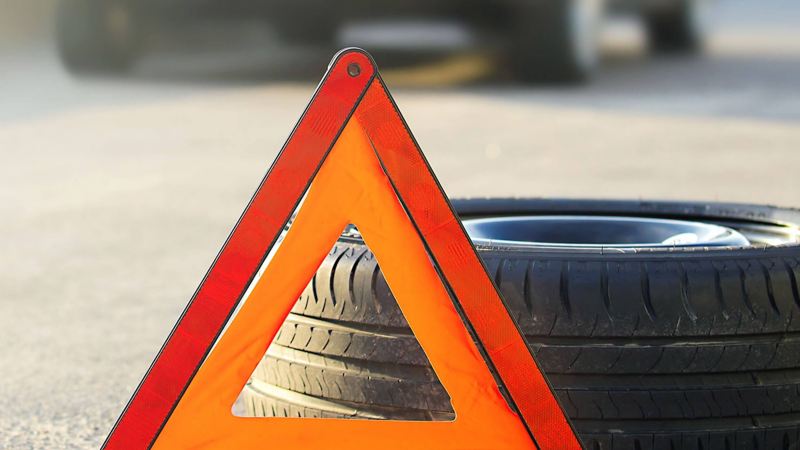 Tyre with warning triangle roadsign