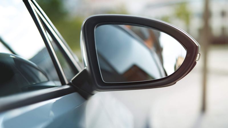 Wing mirror shot of car behind