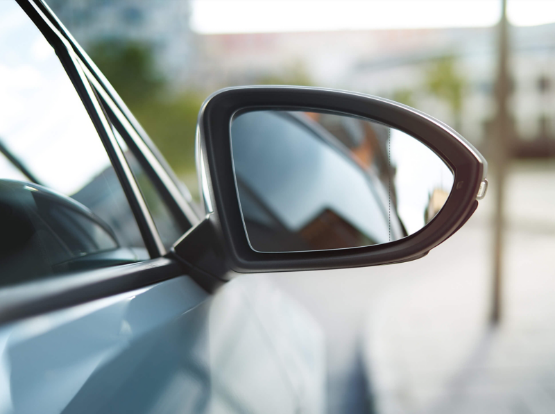 Wing mirror shot of car behind