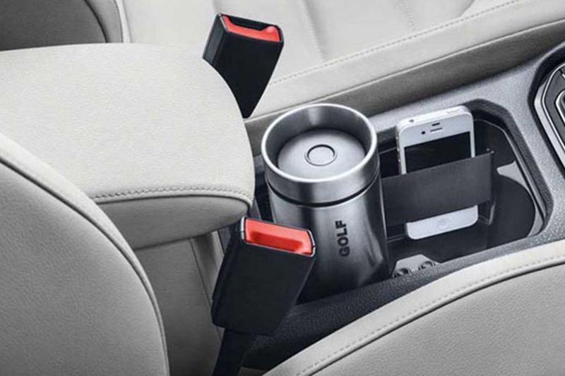 Cup and phone compartments, shown inside a Volkswagen Golf.