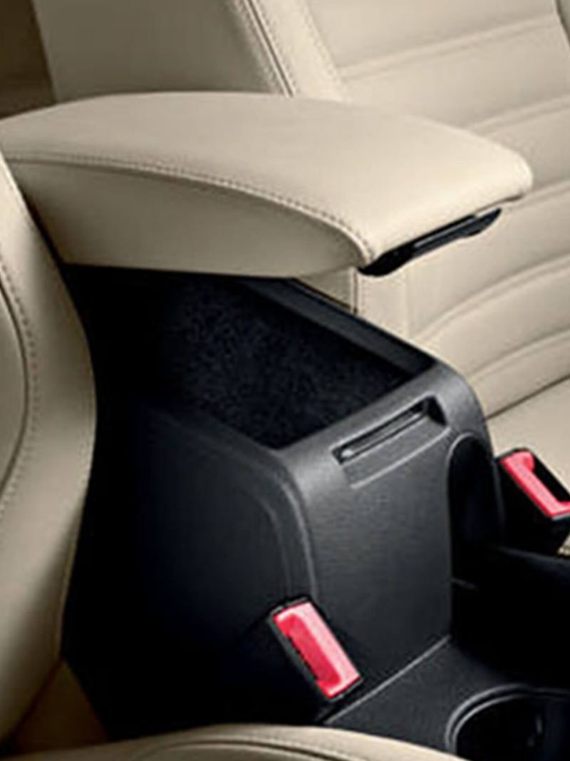 Storage compartment/arm rest between the front driver and passenger seats, inside a Volkswagen Jetta.