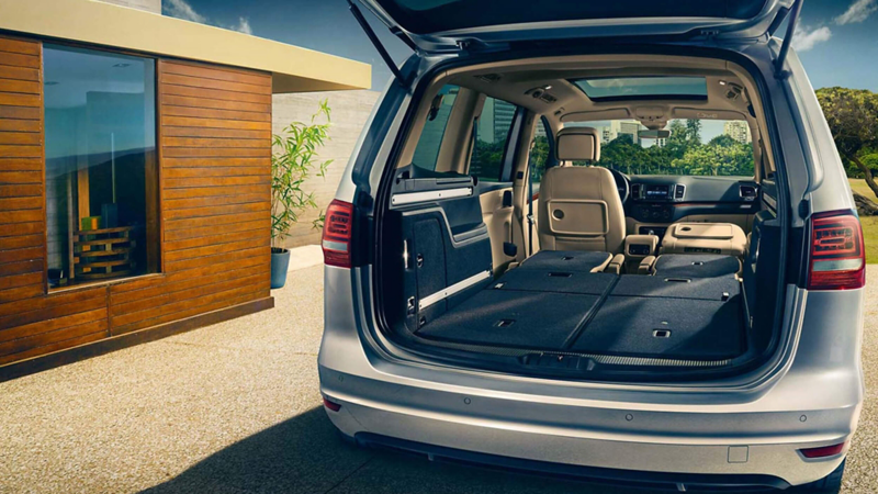 Boot open and passenger seats folded down, inside a Volkswagen Sharan.