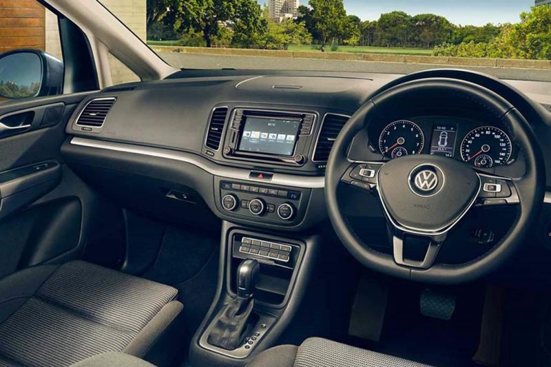 Interior shot of a Volkswagen Sharan, steering wheel and dashboard.