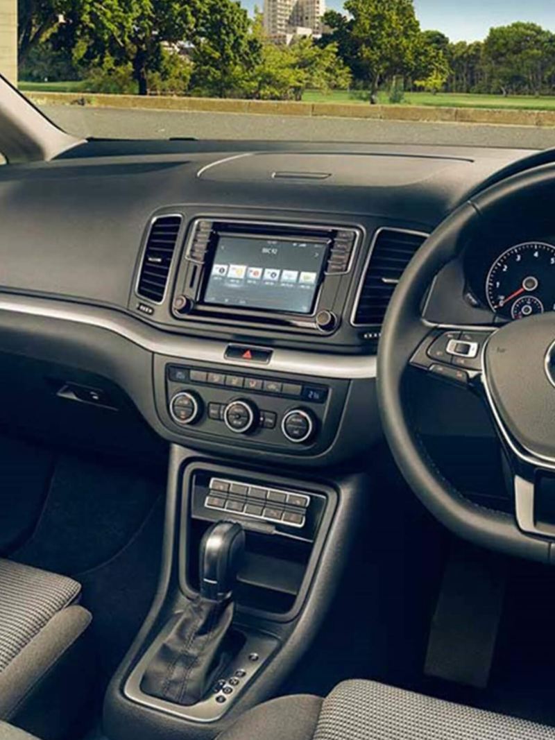 Interior shot of a Volkswagen Sharan, steering wheel and dashboard.
