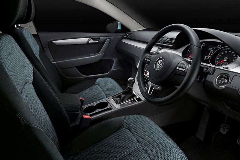 Interior shot of a Volkswagen Passar Estate, steering wheel and dashboard.
