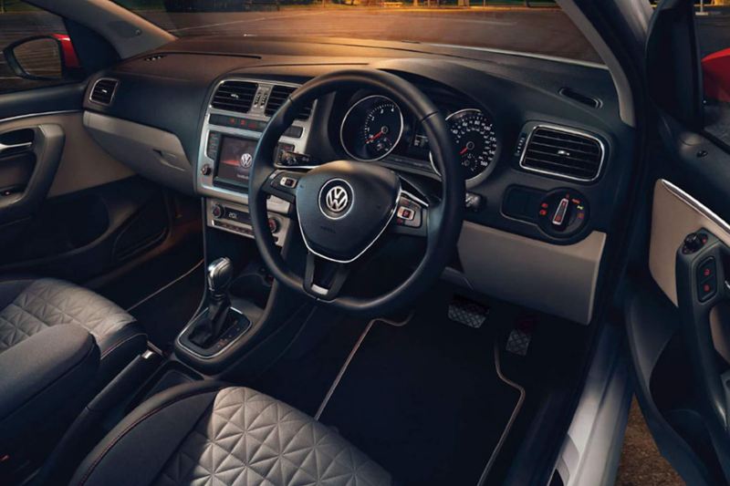Interior shot of a Volkswagen Polo, steering wheel and dashboard.