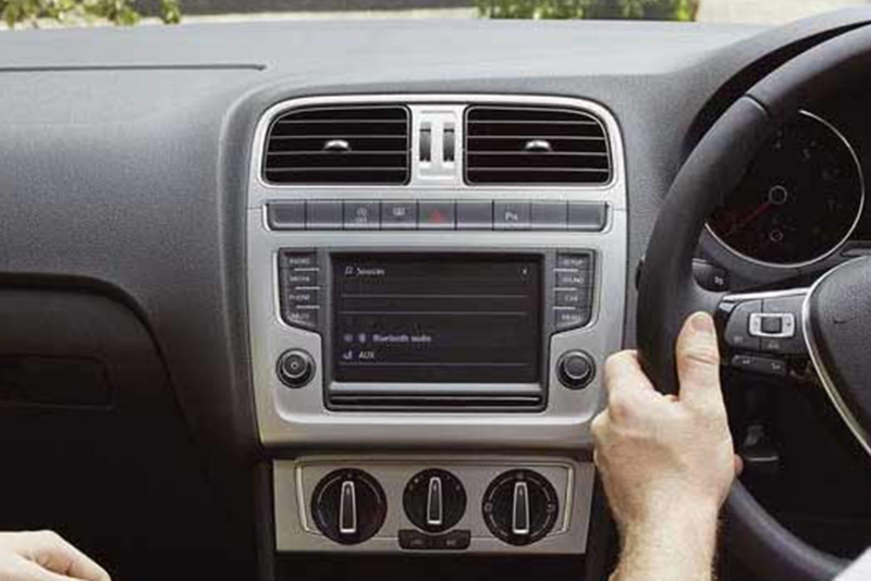 Interior shot of a Volkswagen Polof, steering wheel and dashboard.