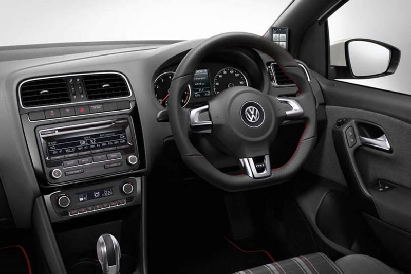 Interior shot of a Volkswagen Polo, steering wheel and dashboard.