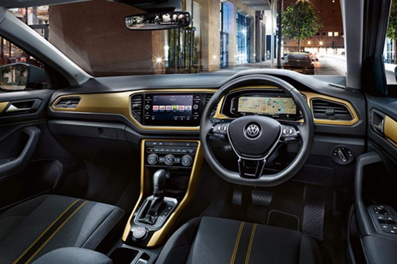 Interior shot of a Volkswagen T-Roc, steering wheel and dashboard.