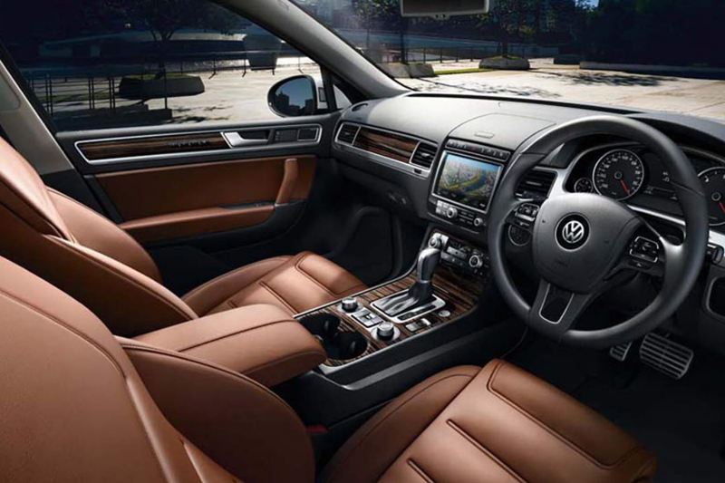 Interior shot of a Volkswagen Touareg, steering wheel and dashboard.