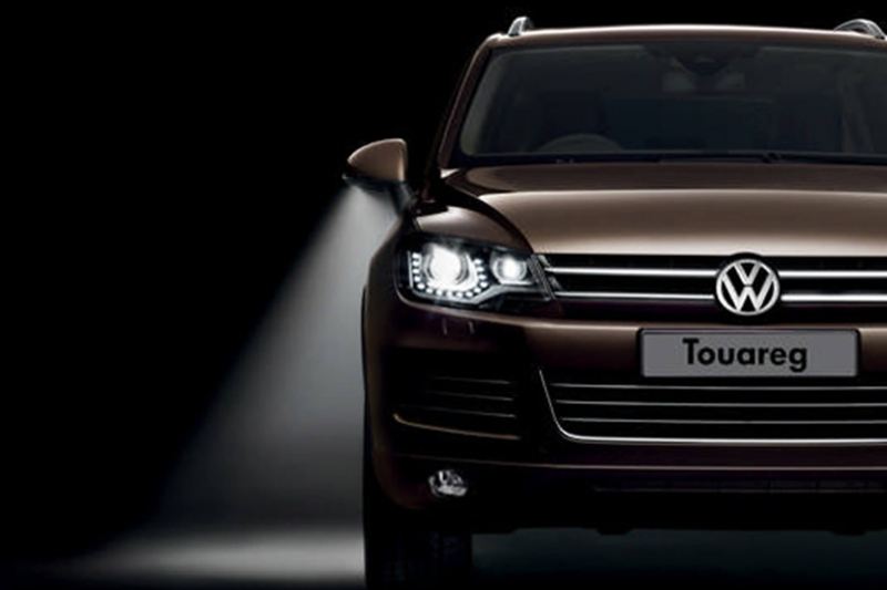 Bronze Volkswagen Touareg, headlight shot.