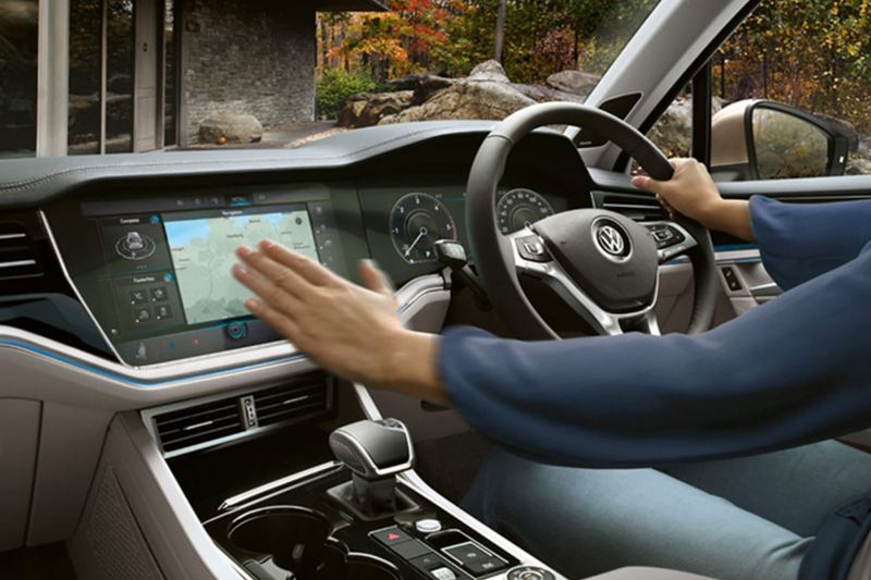 Interior shot of a Volkswagen Touareg, steering wheel and dashboard.