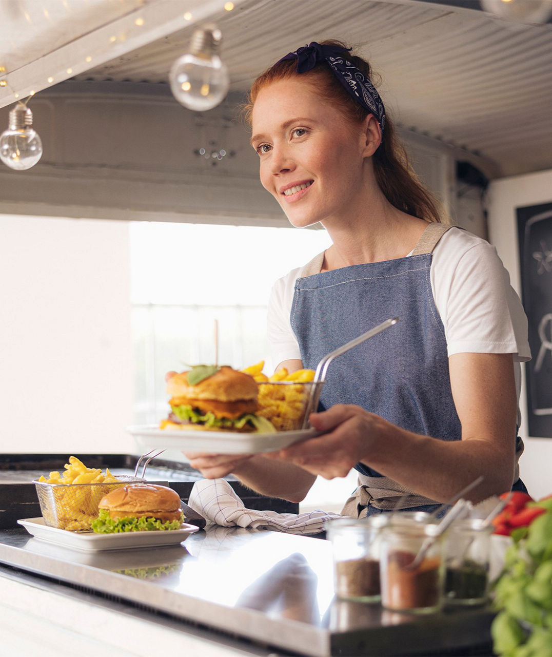Lady in the food truck serving food