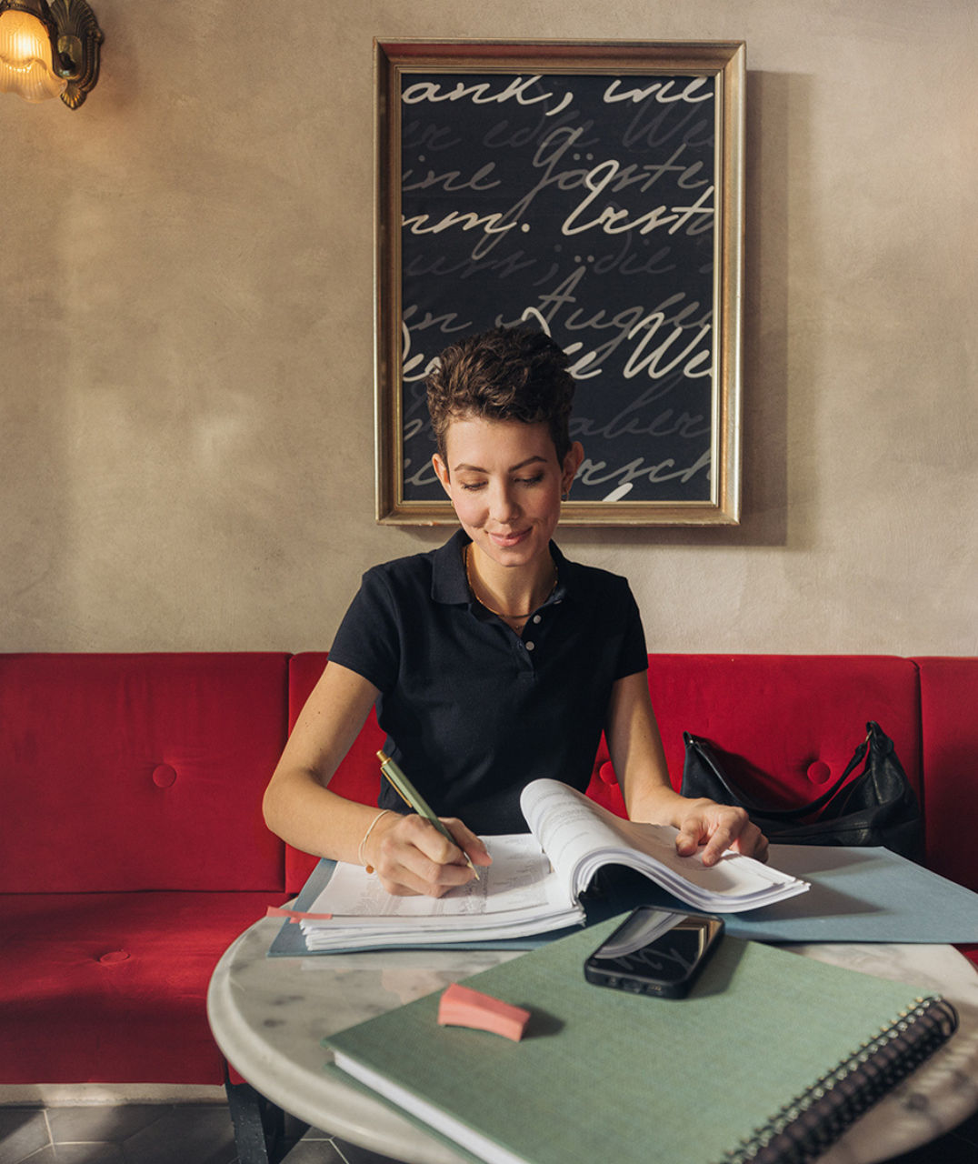 Young lady doing paperwork and smiling
