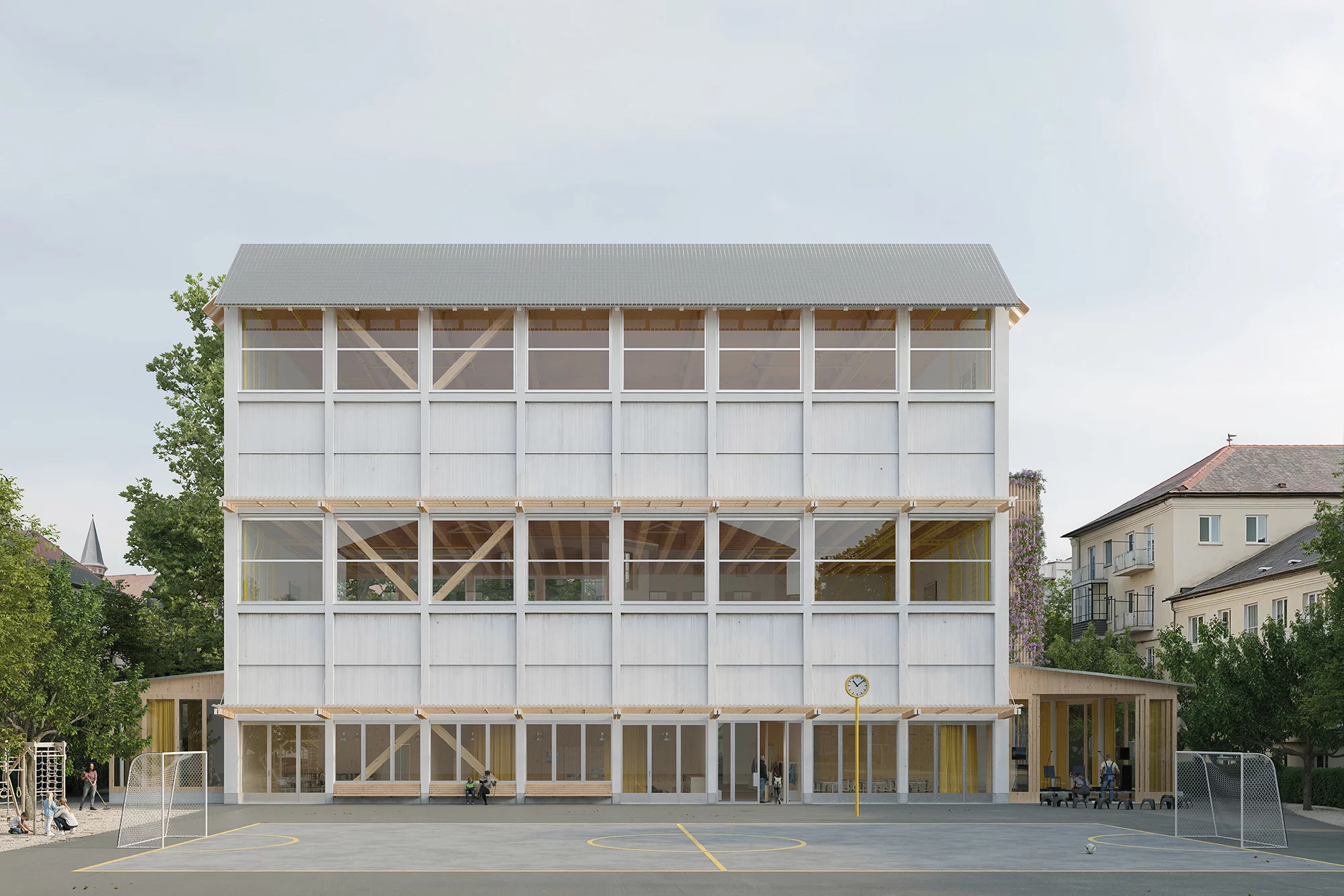 Die Visualisierung des geplanten Bauvorhabens zeigt eine Aussenansicht des Erweiterungsbaus vor dem Allwetterplatz.